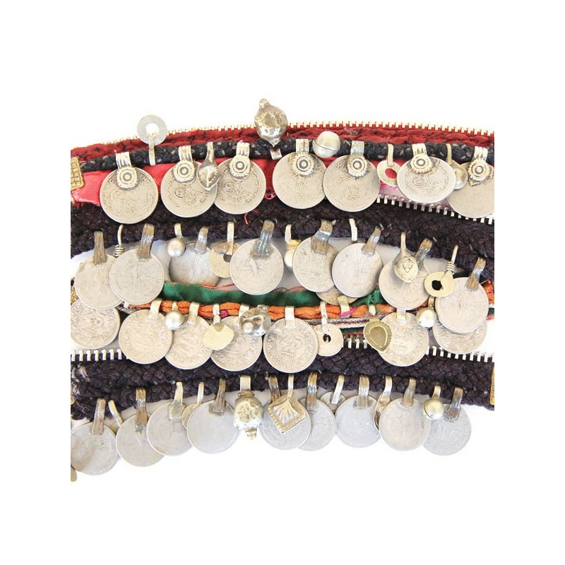 Detail of red Kuchi bracelet with artisanal textures