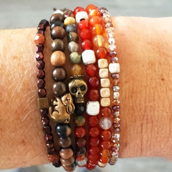 Wooden bead bracelet with bronze Usagi by designer Catherine Michiels.