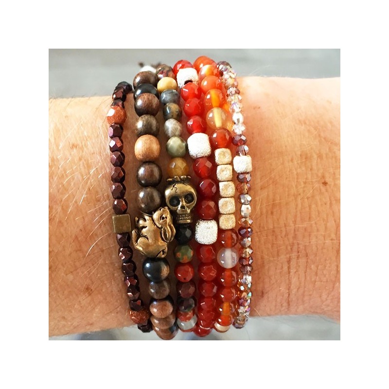 Wooden bead bracelet with bronze Usagi by designer Catherine Michiels.