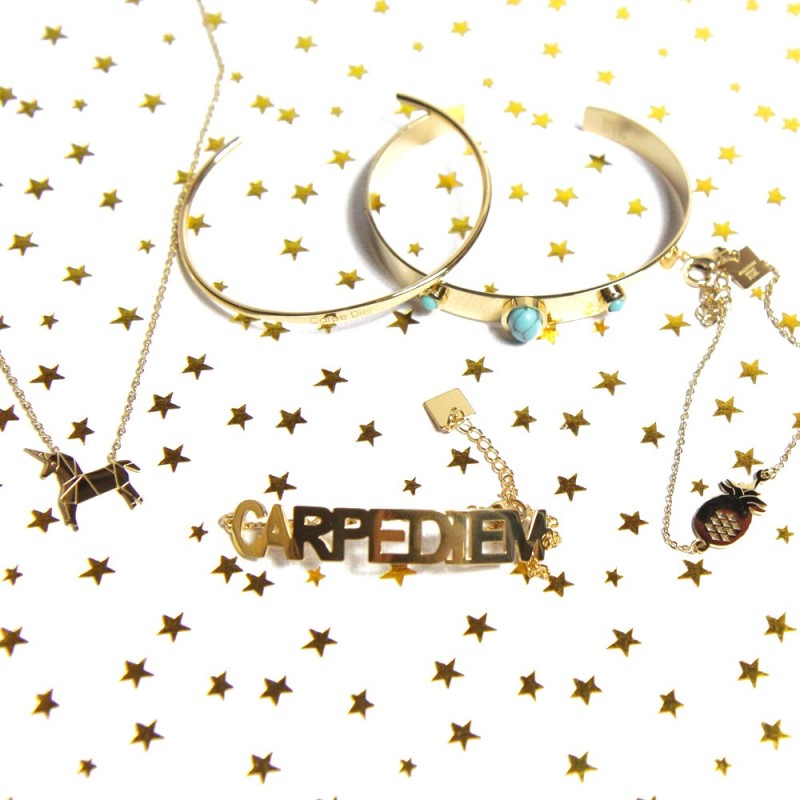 Layered gold bracelets with Carpe Diem articulated design