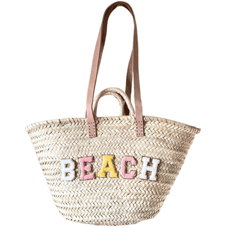 Handwoven palm leaf beach basket with cotton lining